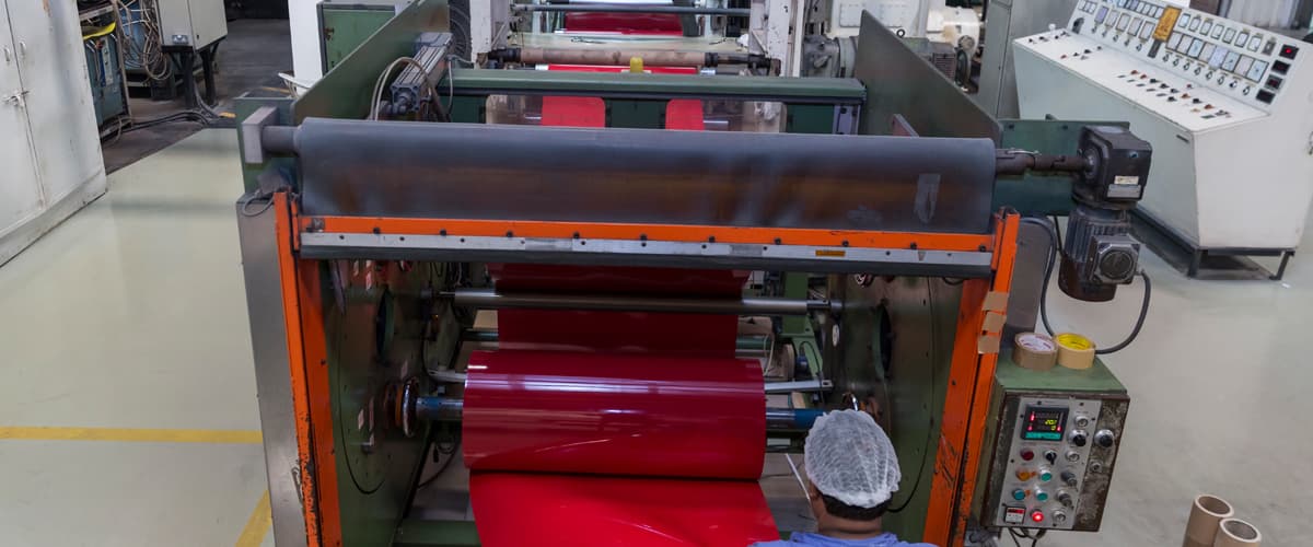 Rigid laminate roll on the production line